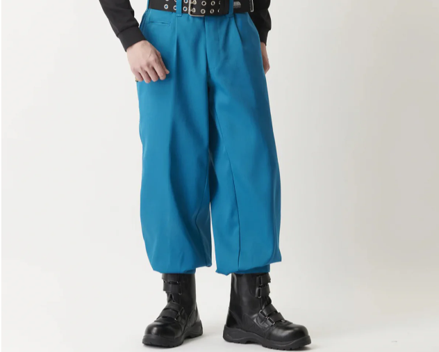 Teal tobi pants with wide-leg silhouette paired with black boots