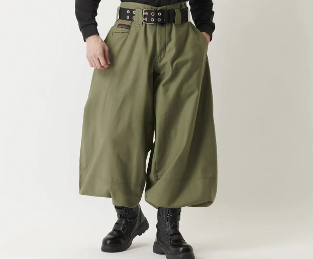 Olive green tobi pants with wide-leg silhouette paired with black work boots