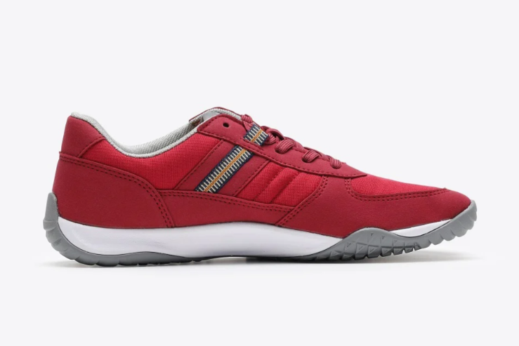 Red low-top work sneaker with lace-up design and white sole