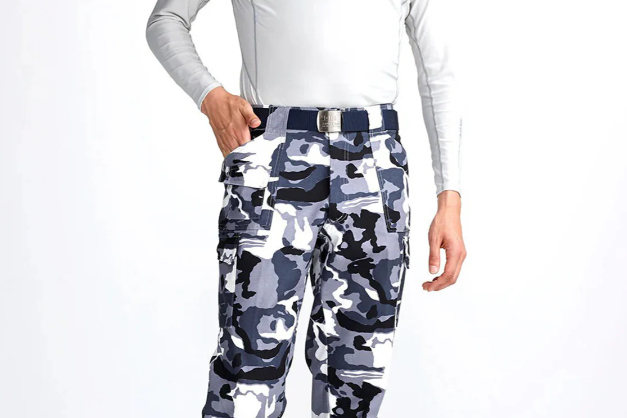 Model wearing gray camouflage Japanese work pants with cargo pockets, a navy belt, and a light gray long-sleeve shirt against a plain studio background.
