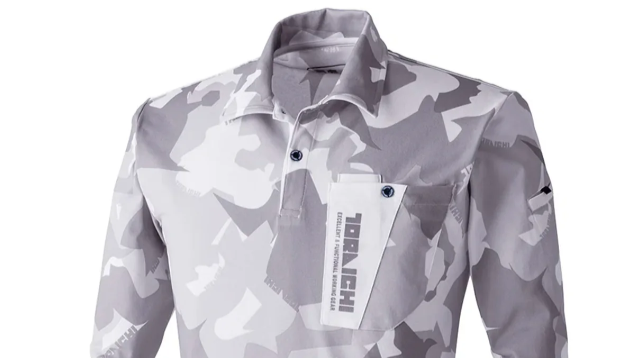 Light gray camouflage long-sleeve work shirt with a collar, chest pocket, and button details, shown against a plain white background.