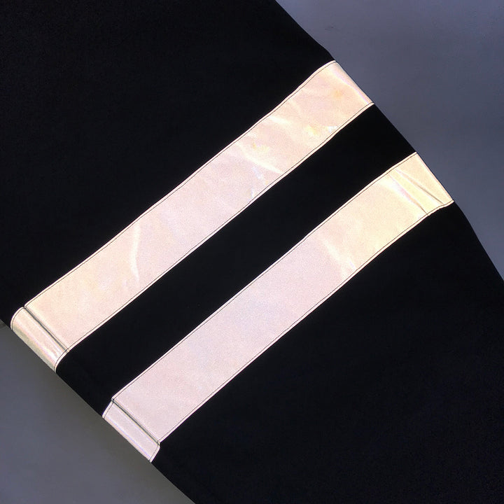 Full-length front view of Toraichi reflective band tobi pants laid flat