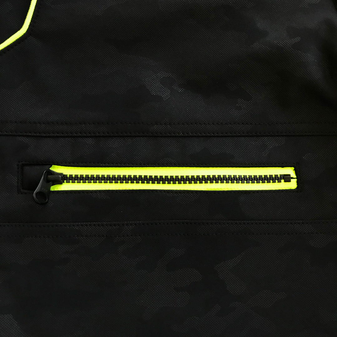Close-up of fluorescent orange zipper pocket on black Toraichi tobi pants