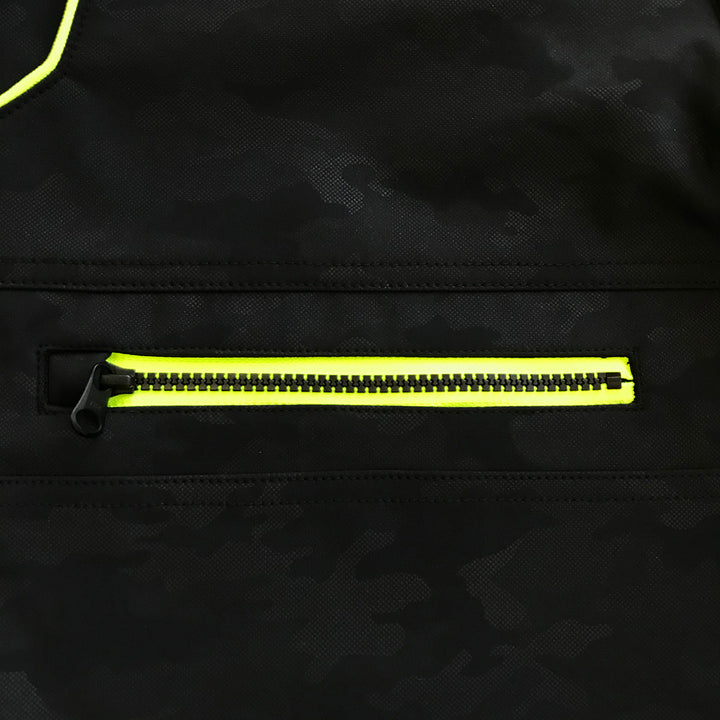 Close-up of fluorescent orange zipper pocket on black Toraichi tobi pants