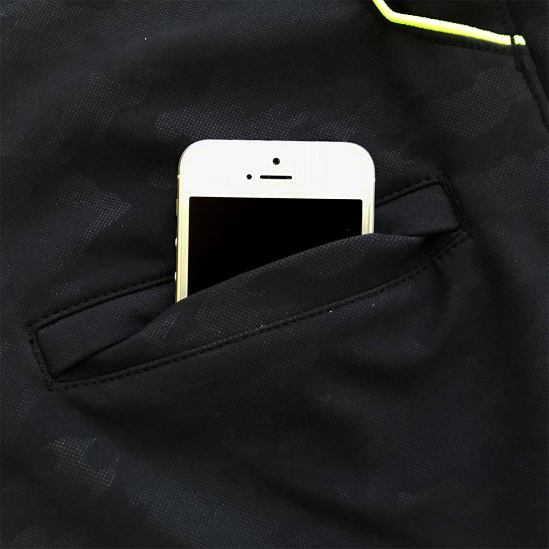 Close-up of fluorescent yellow zipper pocket on black Toraichi tobi pants