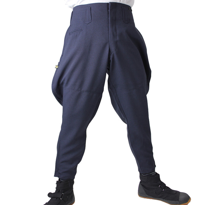 Toraichi tobi pants in navy with traditional riding pants cut, modeled with boots