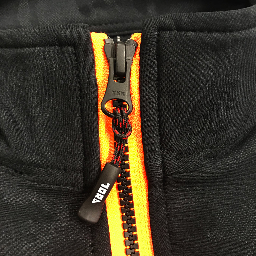 Close-up of zipper and button details on 9520-750 Toraichi jacket