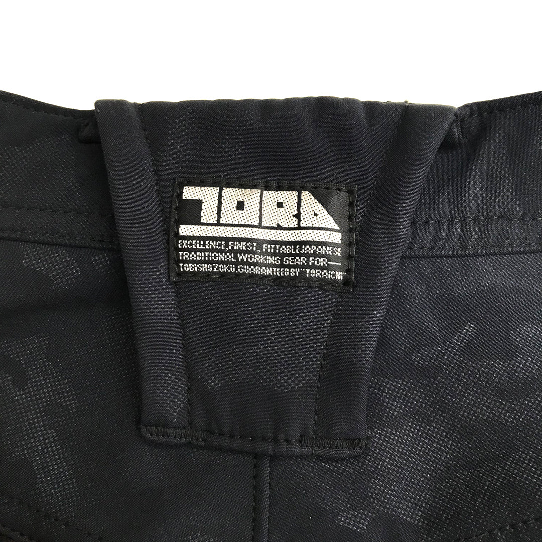 Macro image of the black polyester fabric surface with water-repellent coating and fine texture.