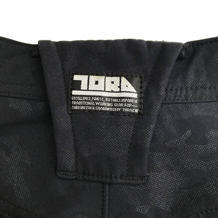 Macro image of the black polyester fabric surface with water-repellent coating and fine texture.