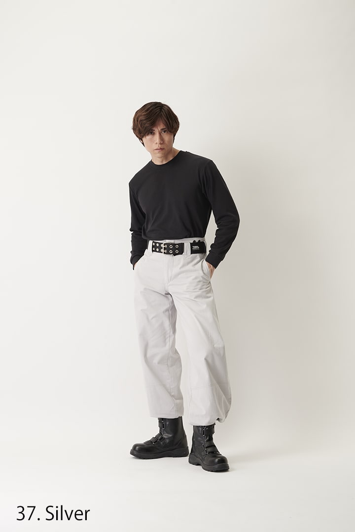 Light grey hachibu pants showing extended length and narrow ankle finish