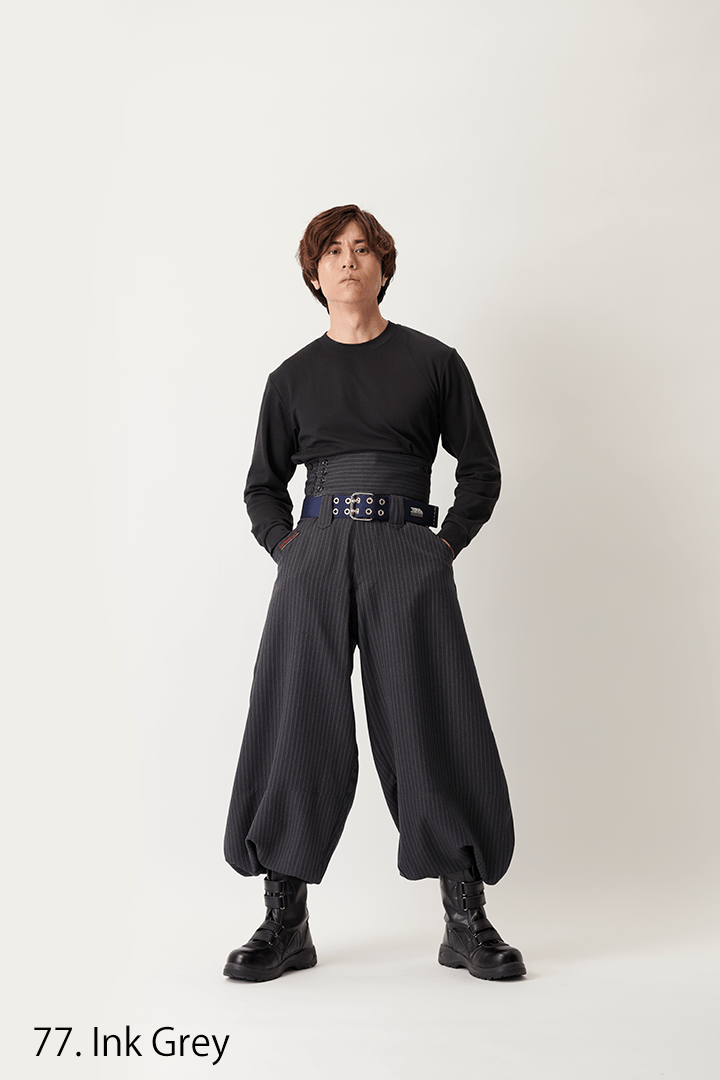 Super long hachibu pants styled with black boots and workwear belt