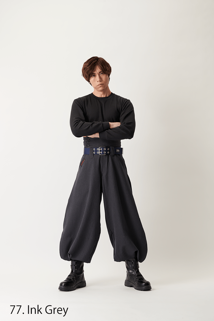 Wide-leg hachibu pants paired with tall boots and a thick waist belt