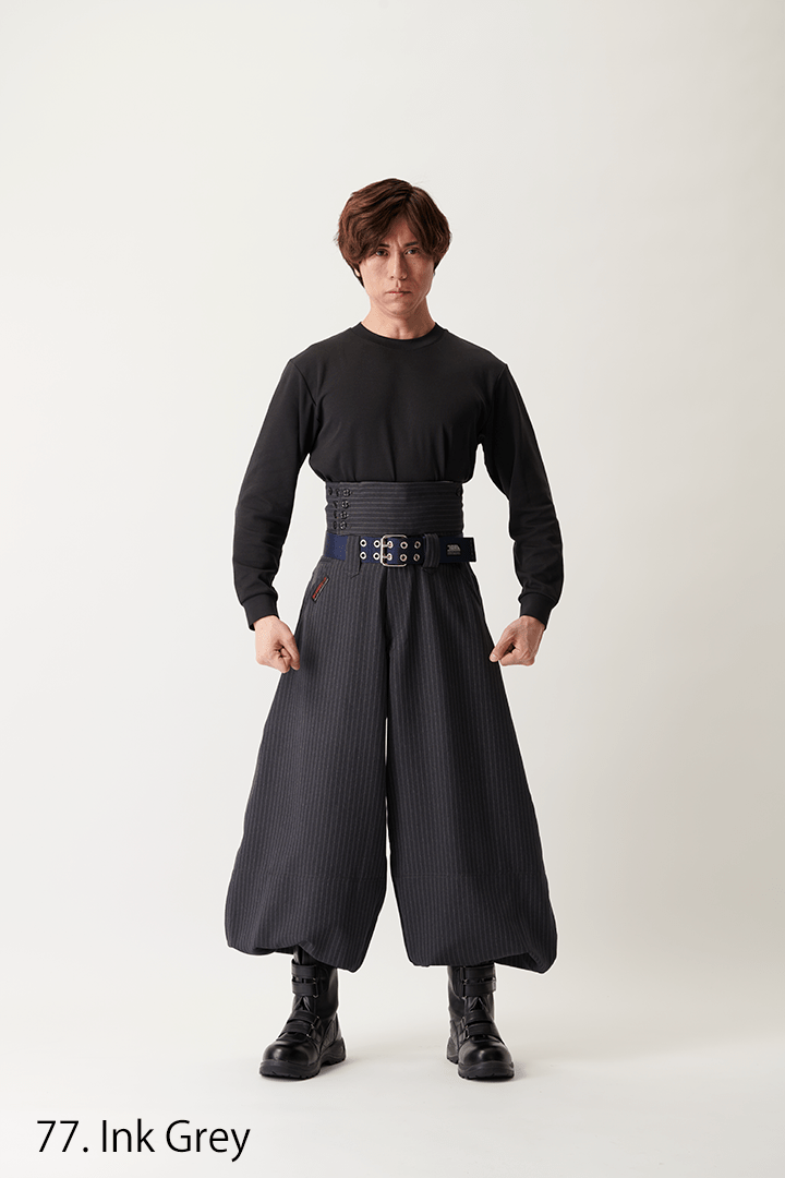Oversized Japanese workwear trousers with dramatic balloon silhouette