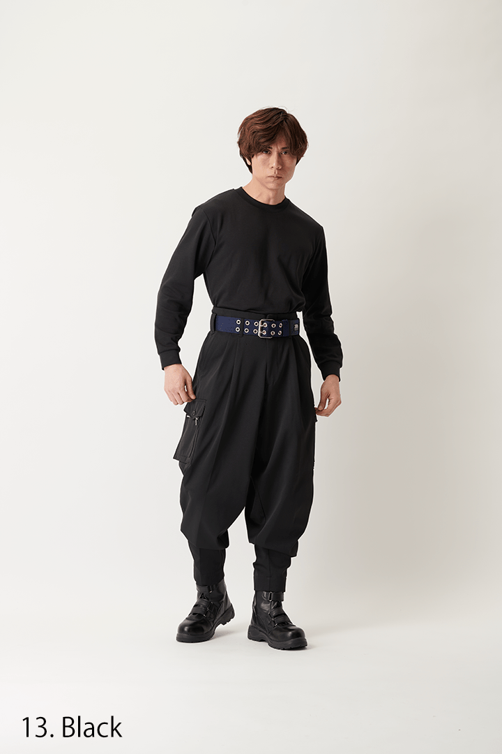 Workwear-style K-1 pants in black showing relaxed fit and practical pockets