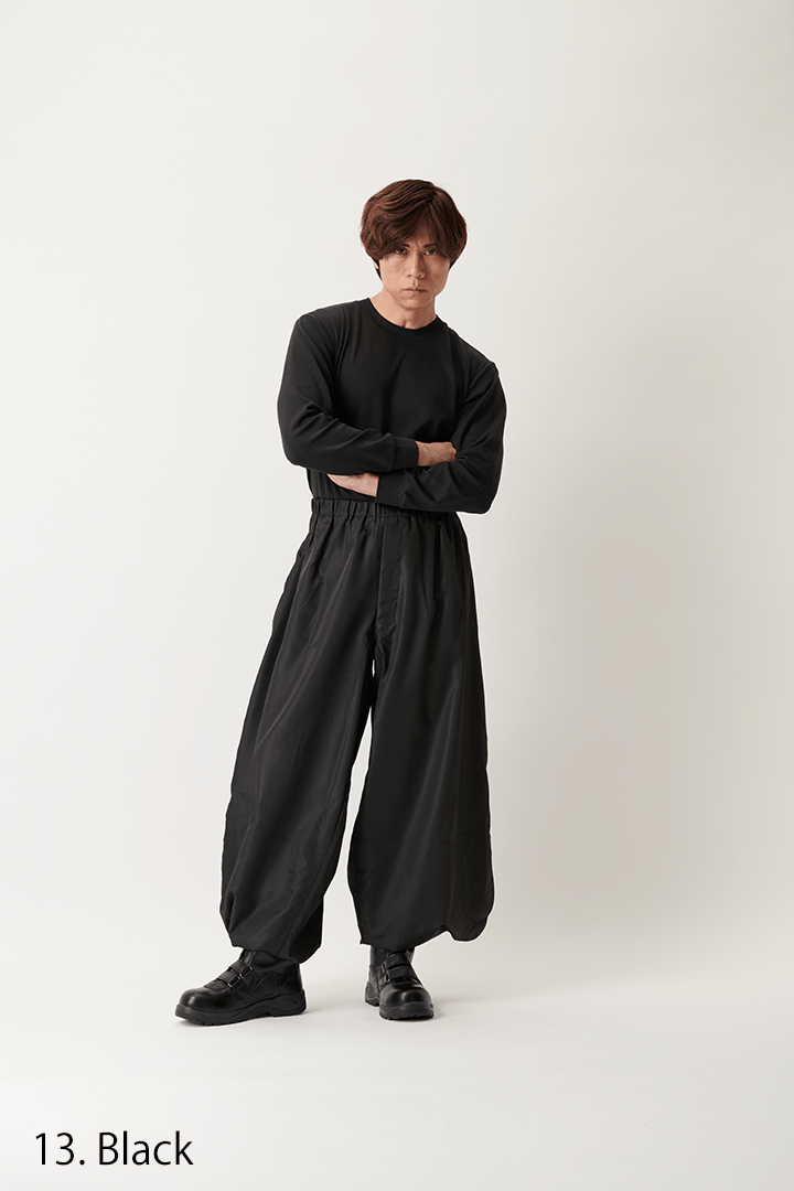 Full body model wearing Toraichi Yakke pants in black polyester