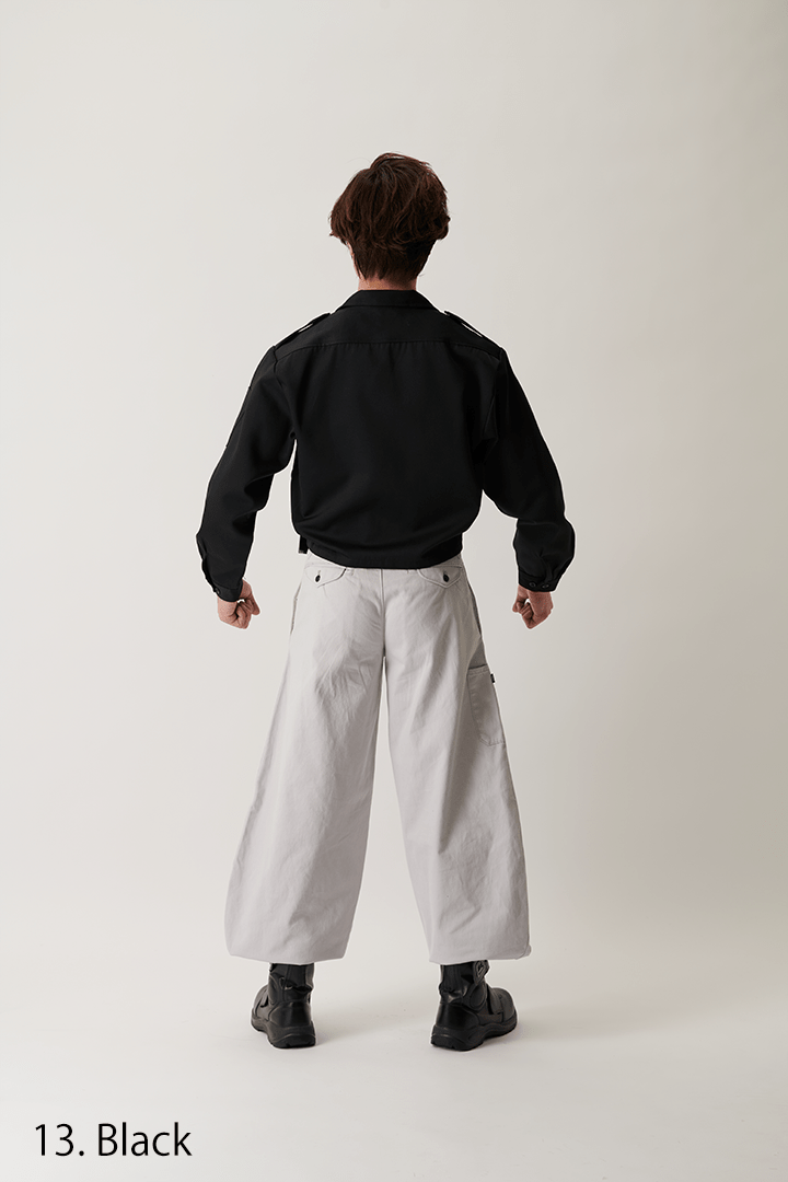Close-up of chest pocket on black short open shirt