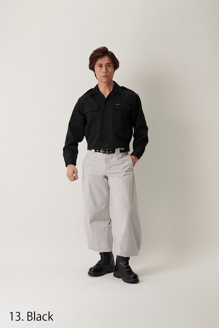Back view of black short open shirt on model
