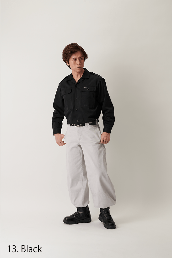 Side view of black short open shirt on model