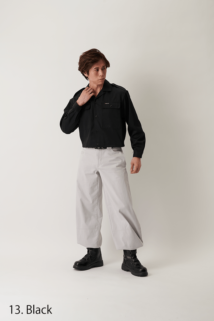 Angled front view showing fit of black short open shirt