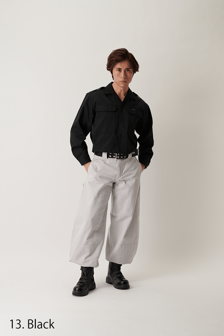 Full body front view of model wearing black short open shirt