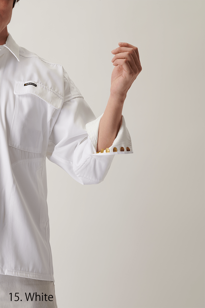 Back view of white long sleeve shirt showing loose fit