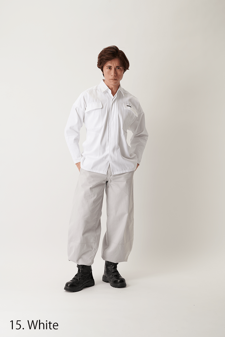 White shirt shown in natural lighting, outdoor forest background