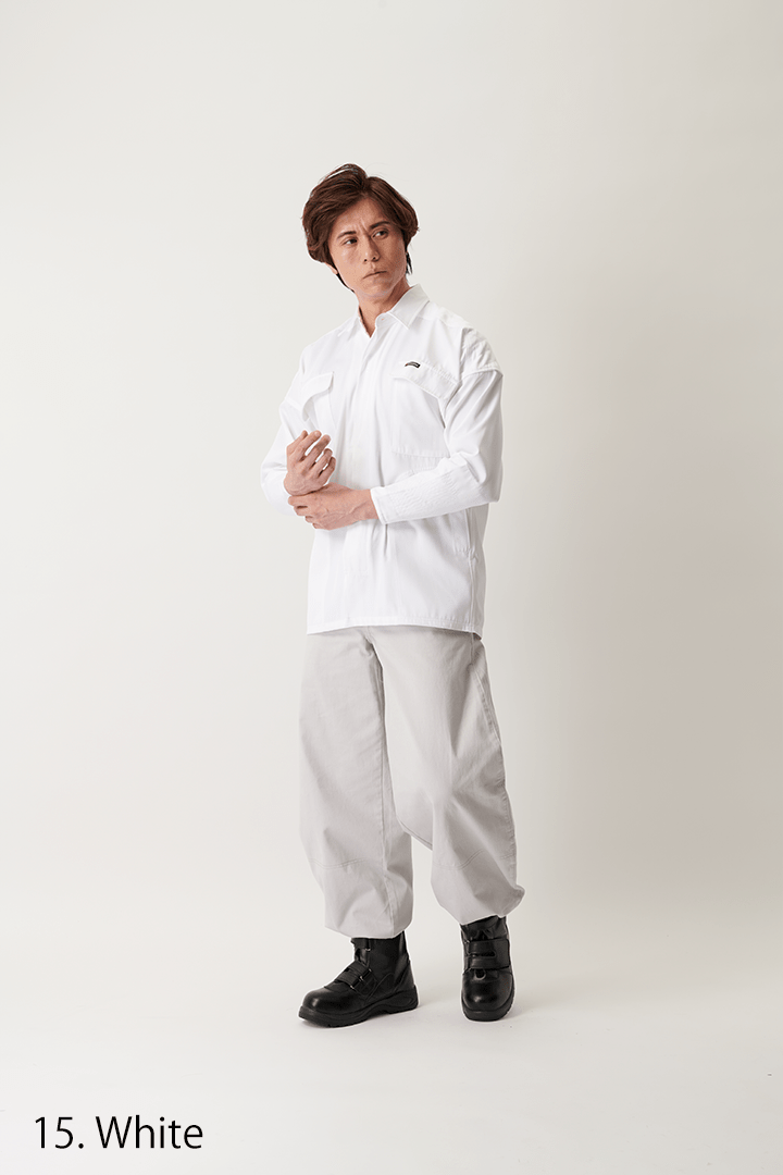 Full body view of model wearing white work shirt with long sleeves
