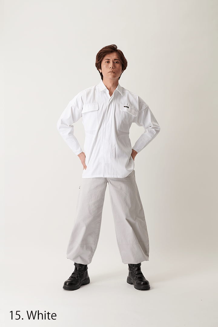 White shirt viewed under cloudy sky background, casual outdoor pose