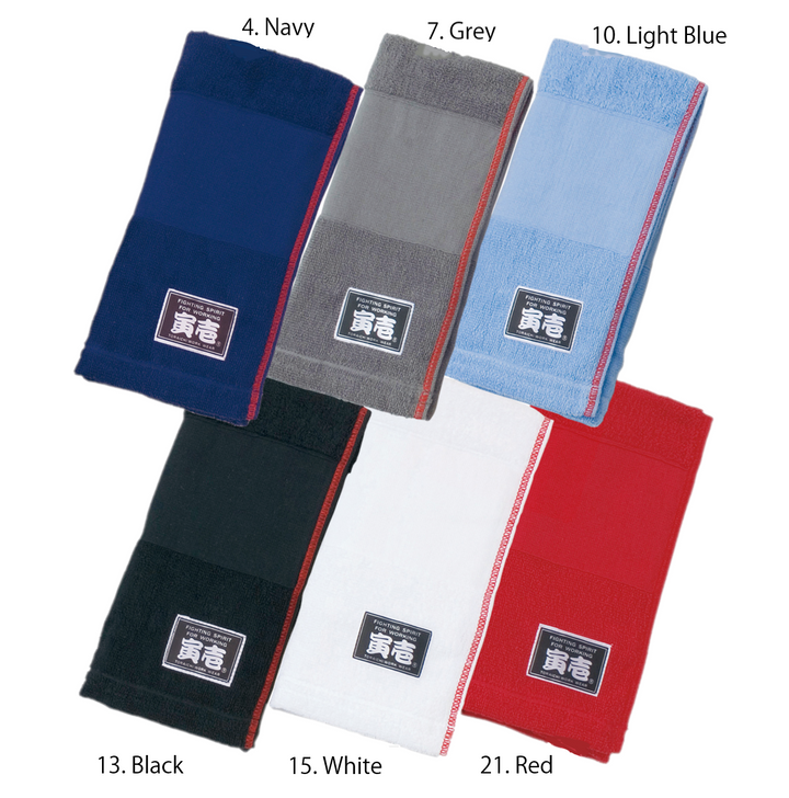 Assorted Toraichi towels in navy, grey, black, and red colors with brand labels displayed