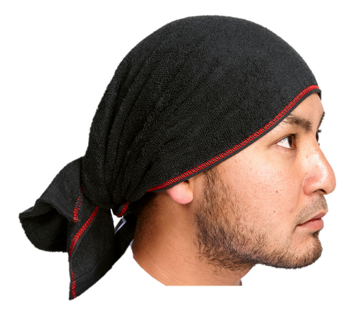 Model wearing a black Japanese workwear towel with red stitching tied around the head