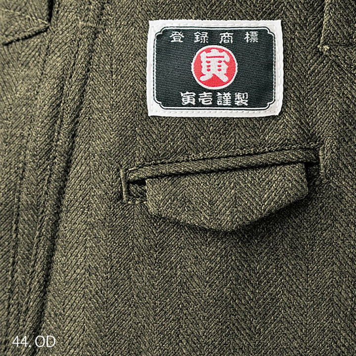 Pocket stitching detail of Japanese tobi pants in olive brown fabric