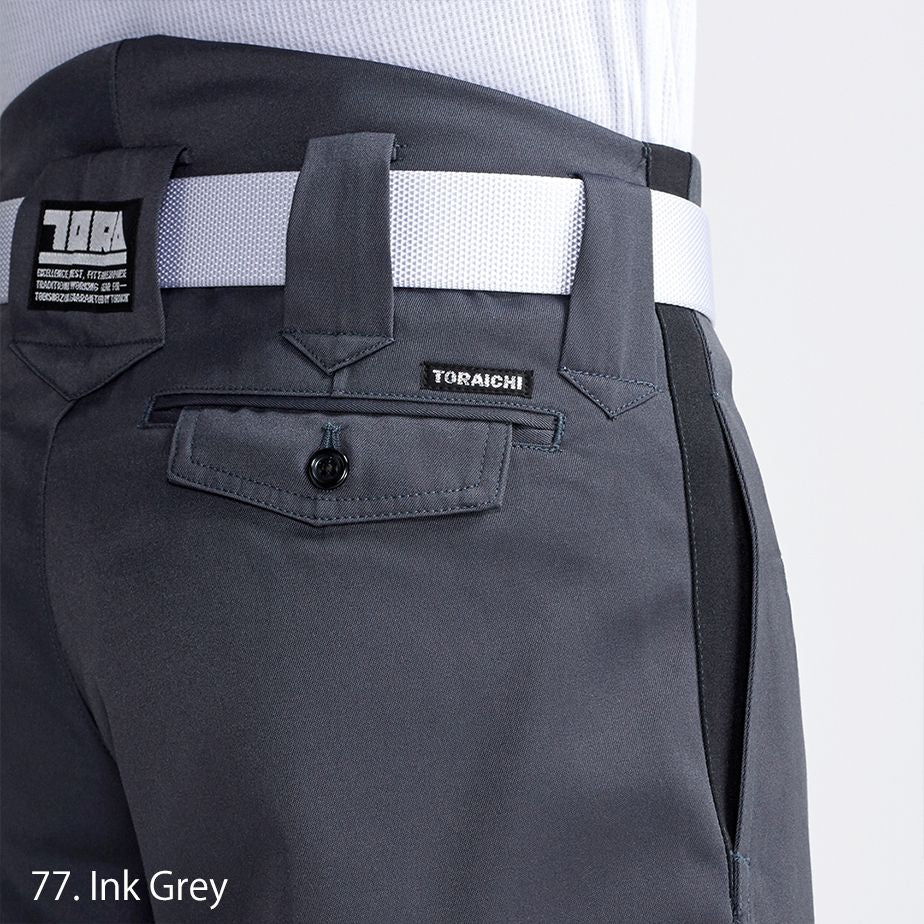 Close-up of black boots tucked into Toraichi tobi pants with reinforced cuff detail