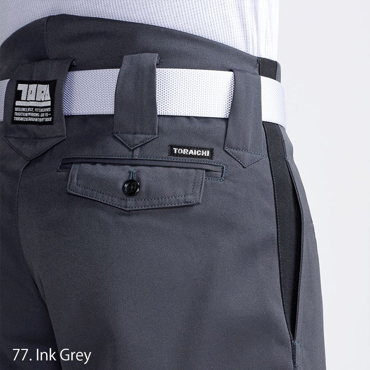 Close-up of black boots tucked into Toraichi tobi pants with reinforced cuff detail