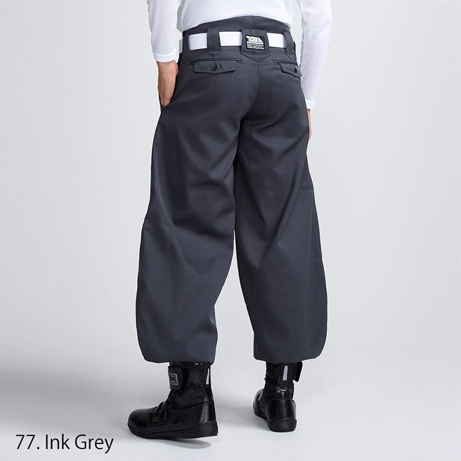 Back view of Toraichi tobi pants showing wide leg and structured silhouette
