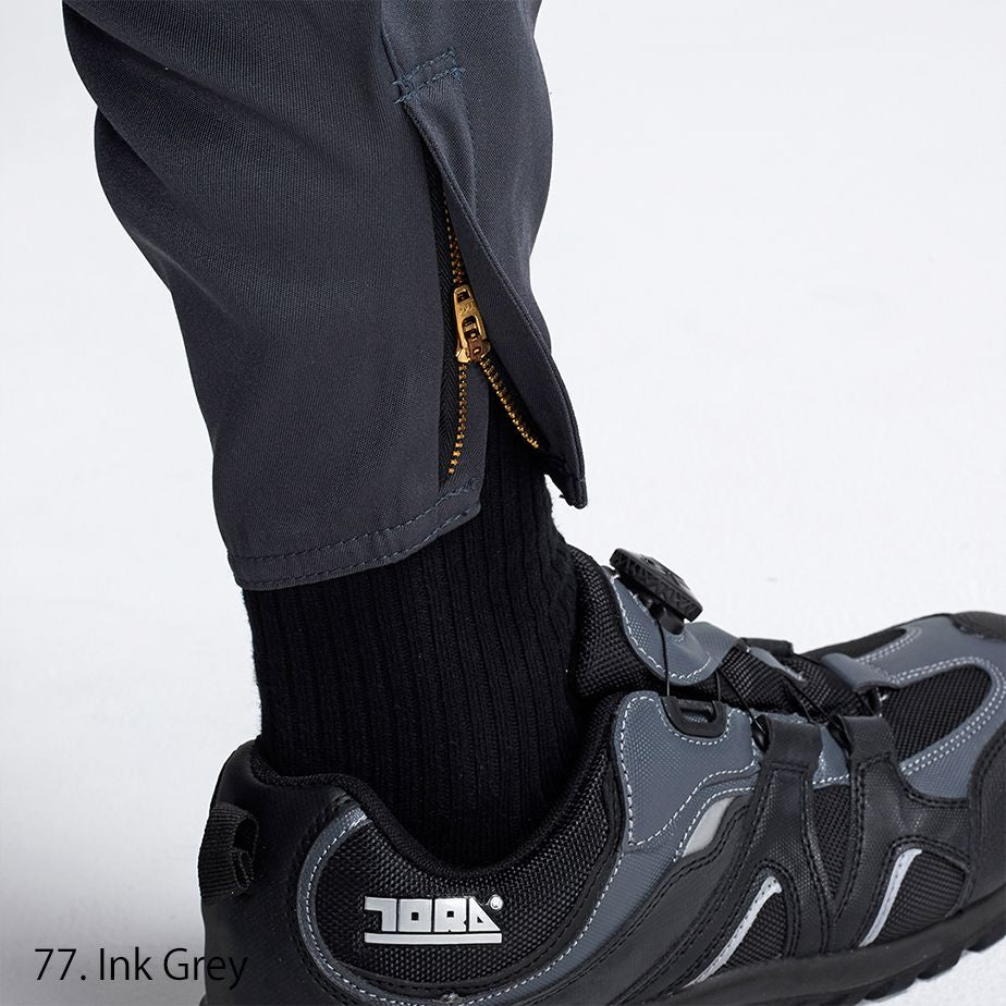 Side profile of Toraichi tobi pants highlighting the long straight cut and wide hem