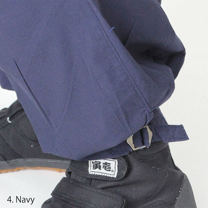 Front view of Toraichi beige tobi pants with pleated construction