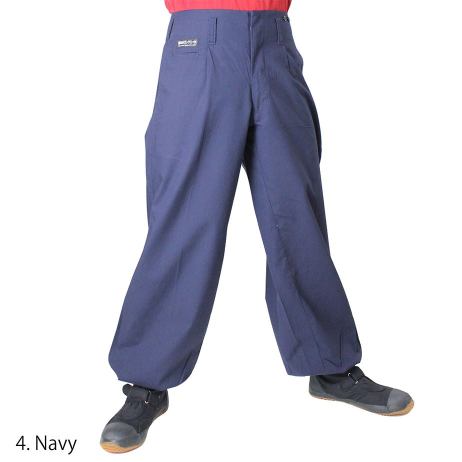 Side profile of Toraichi tobi pants showing roomy cut and taper