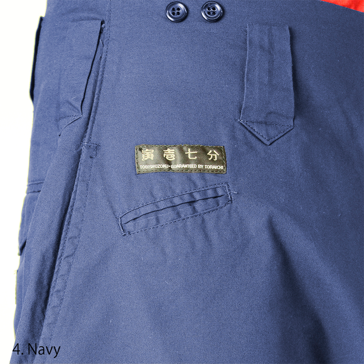 Side view of Navy Tobi Pants styled with work boots