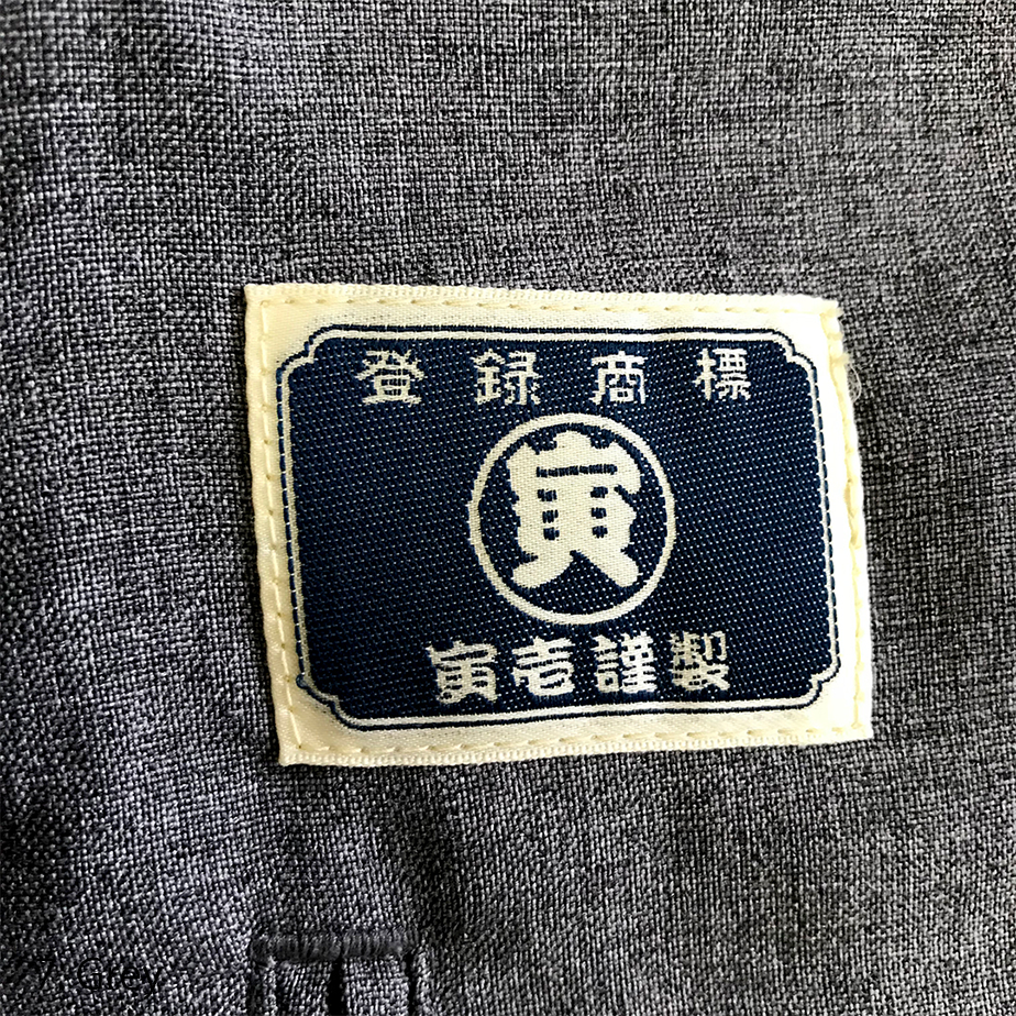 Toraichi pants interior label showing authenticity and brand details