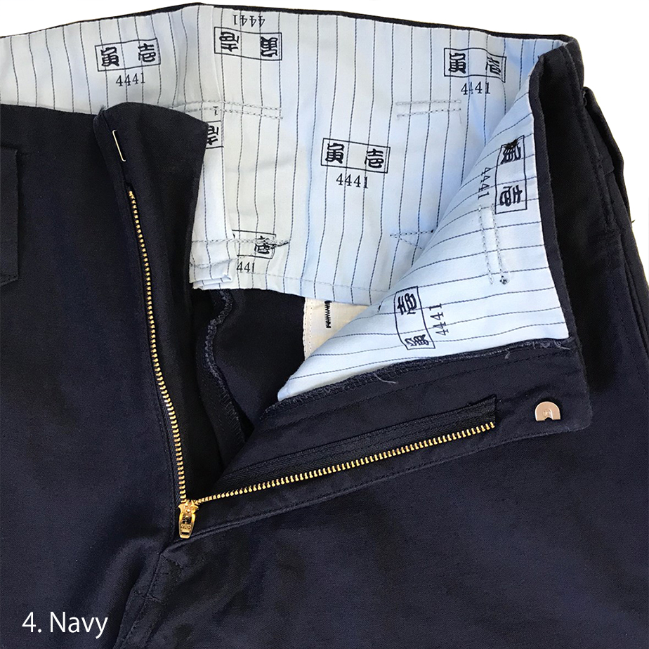 Zipper detail close-up on navy Toraichi tobi pants front opening