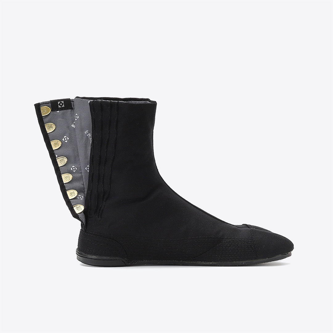 Bottom sole of black Tabi footwear highlighting grip texture