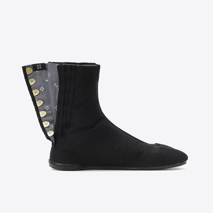 Bottom sole of black Tabi footwear highlighting grip texture