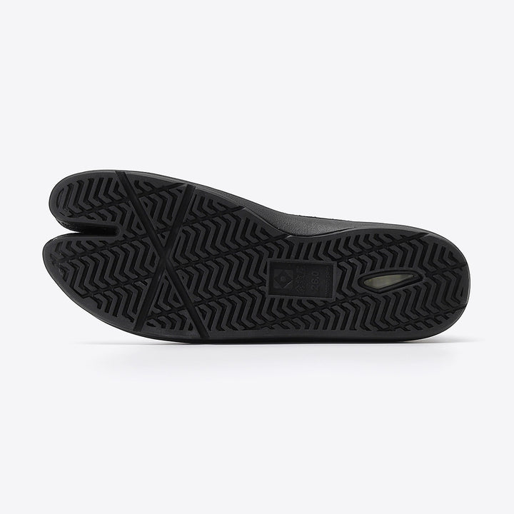 Flat lay of black Japanese Tabi footwear showing split-toe construction