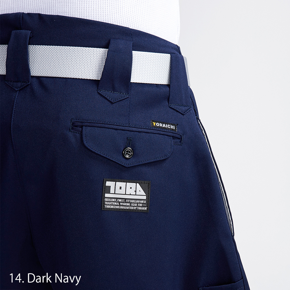 Rear view of Toraichi tobi pants in dark navy, paired with black work boots for a bold profile
