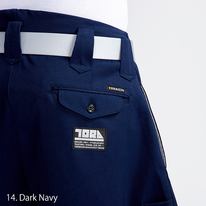 Rear view of Toraichi tobi pants in dark navy, paired with black work boots for a bold profile