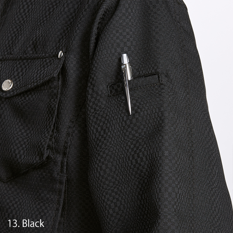 Detailed view of the chest pocket with button flap and Toraichi tag