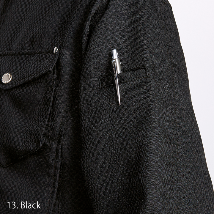Detailed view of the chest pocket with button flap and Toraichi tag