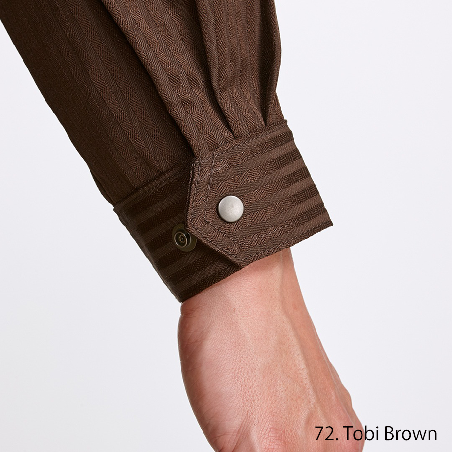 Fabric texture close-up highlighting durable brown day-and-night weave for Japanese workwear
