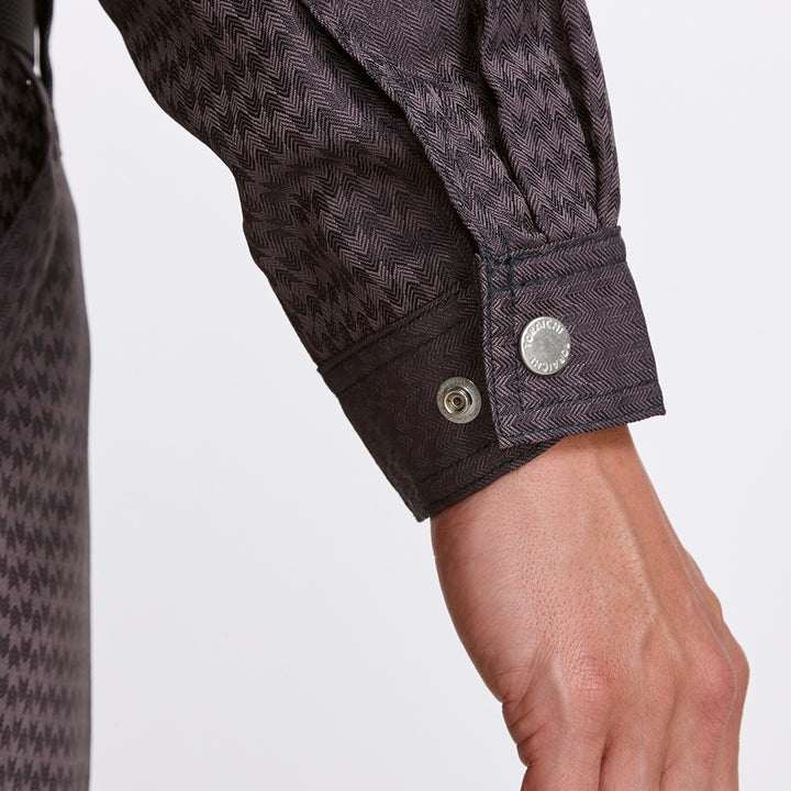 Model in standing pose wearing dark grey tobi uniform with straight silhouette