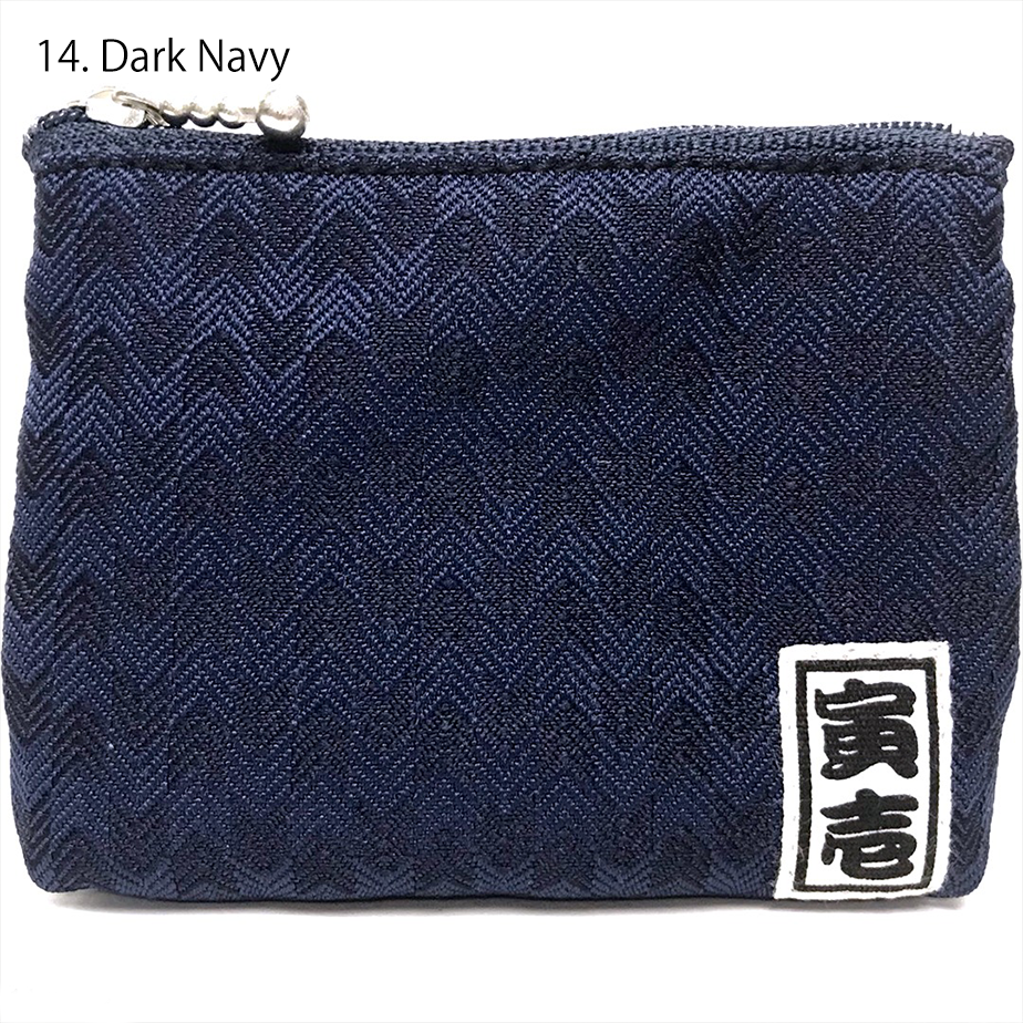 Close-up of Toraichi herringbone fabric texture and zipper detail